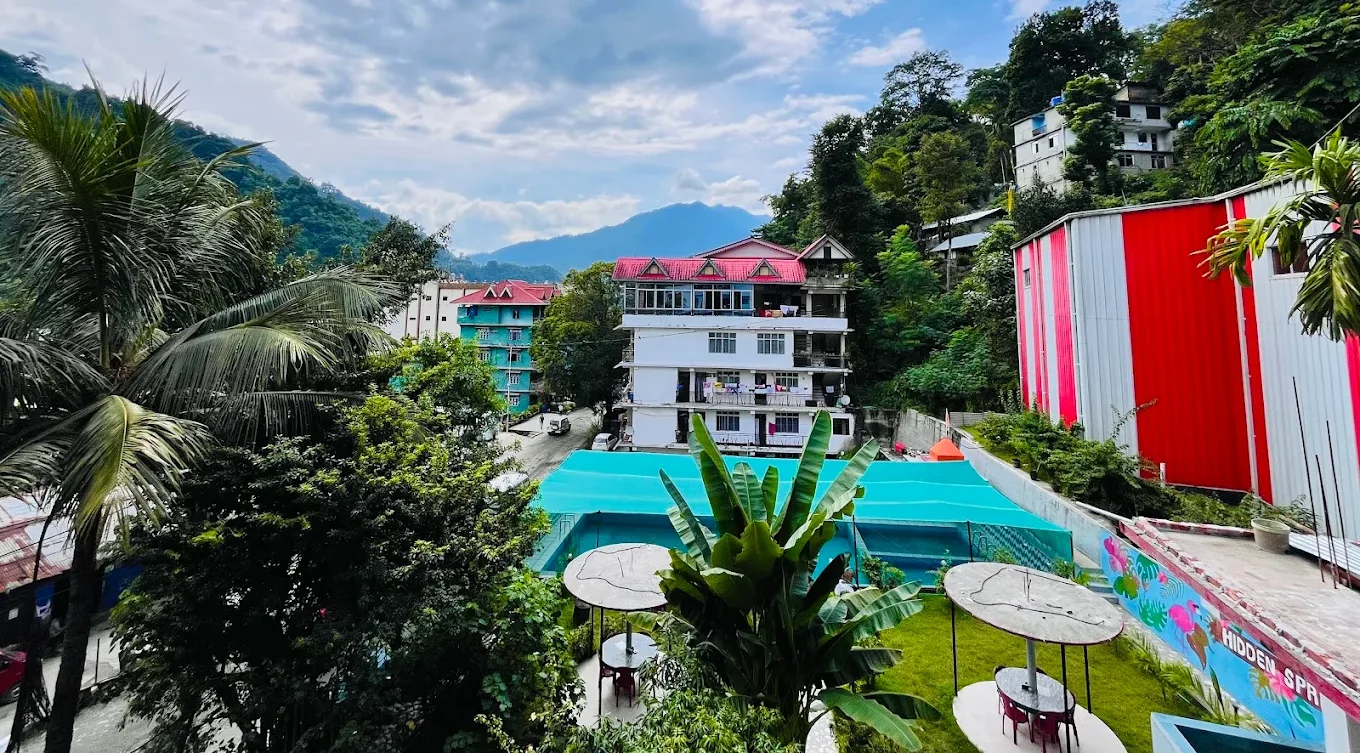 Hidden Spring Resort exterior with mountain and sky views in Sikkim.